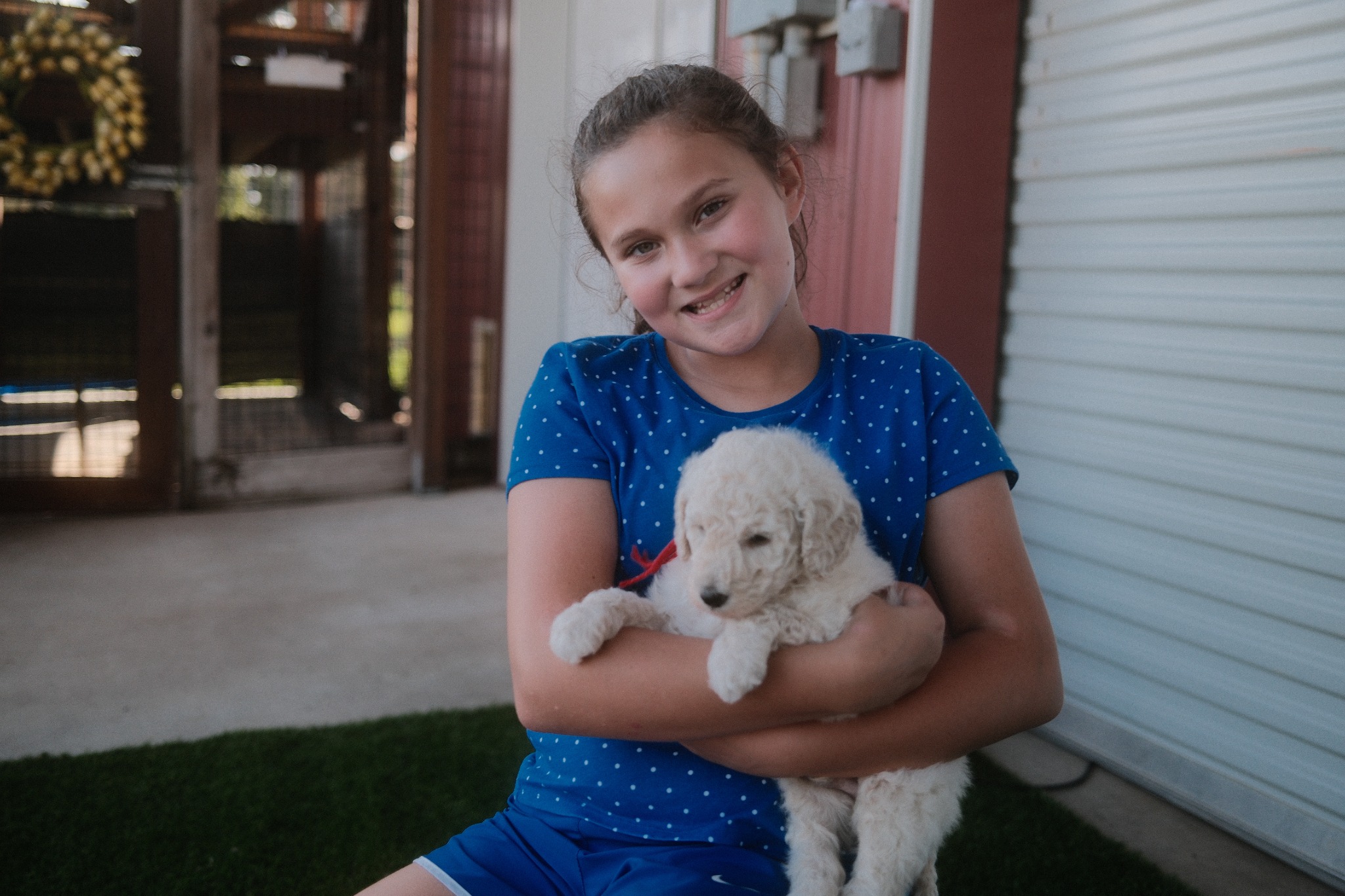 A family dog enjoying time outdoors at the Texas Doodles home in Kountze, Texas